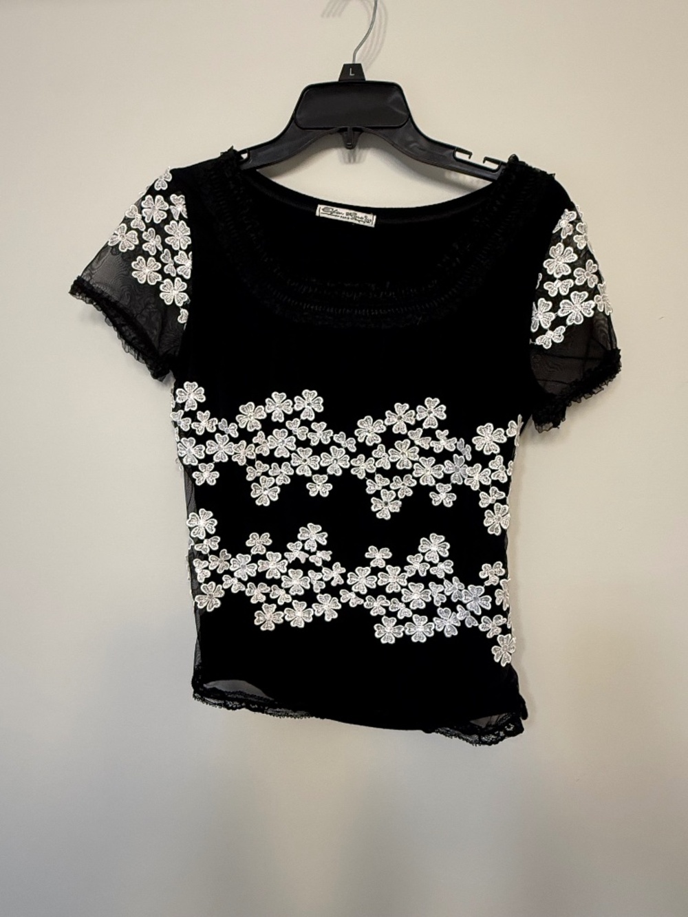 Black top with sparkled flowers